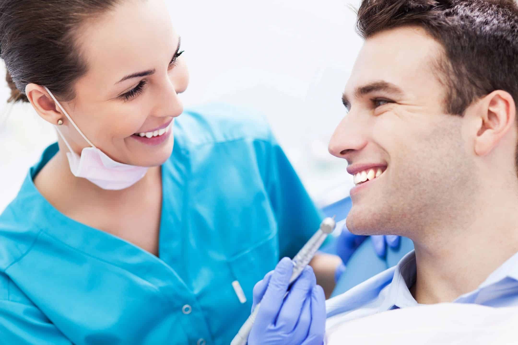 a dentist working on someone's teeth