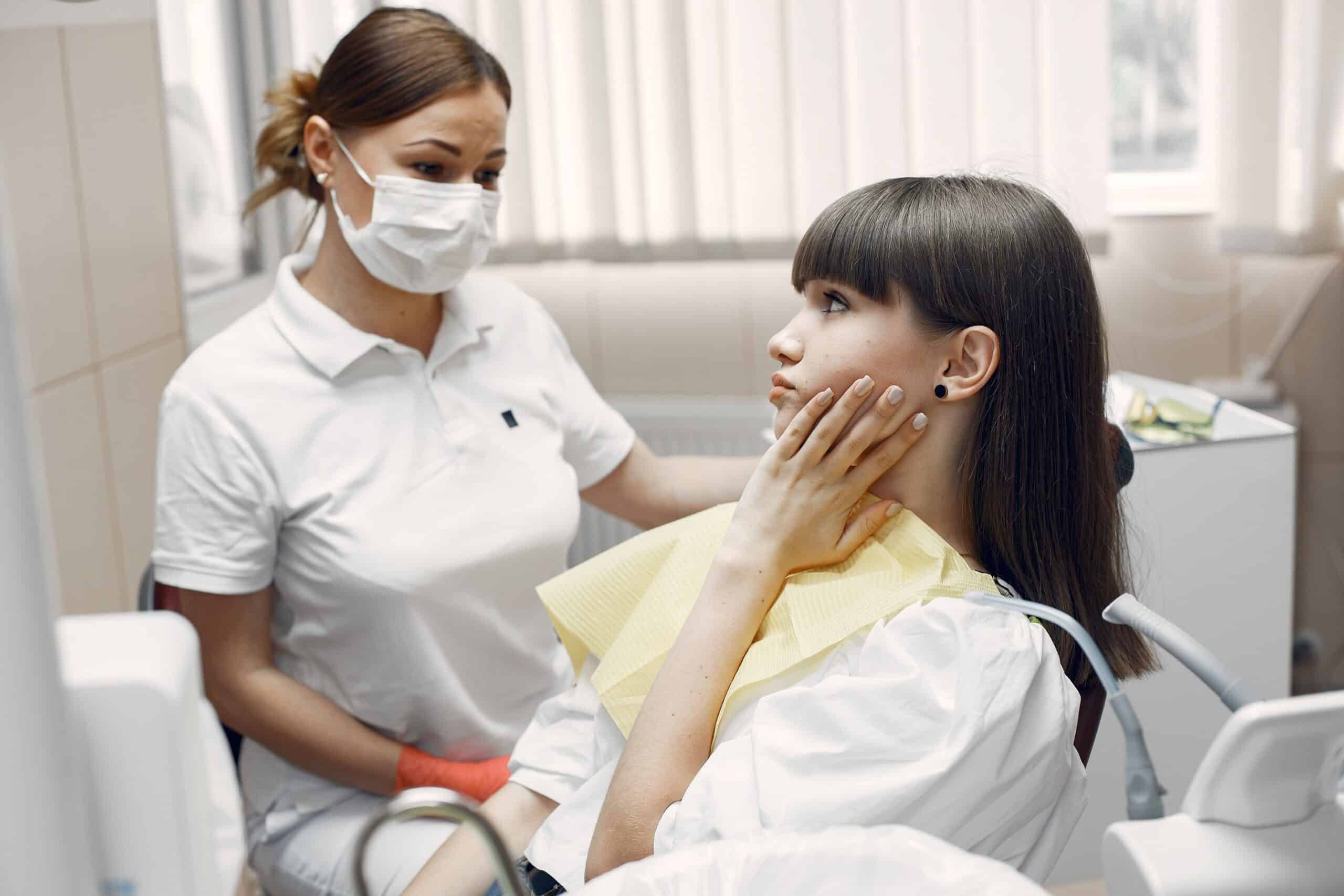 Dentist reassuring patient